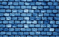 Old grungy brick wall surface in navy blue tone Royalty Free Stock Photo