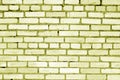 Old grungy brick wall surface in yellow tone Royalty Free Stock Photo