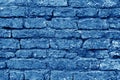 Old grungy brick wall texture in navy blue tone Royalty Free Stock Photo