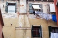 Old grungy building with linen outside Royalty Free Stock Photo