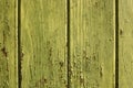 Old grungy green wood wall. Green painted wooden wall plank frame as simple saturated green peeling paint timber old grungy Royalty Free Stock Photo