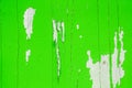 Old grungy and weathered green painted wooden wall plank texture background peeling off Royalty Free Stock Photo