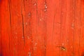 Old grungy and weathered red and orange painted wooden wall plank texture background Royalty Free Stock Photo