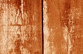 Old grungy wooden planks background in orange tone