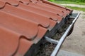 An old gutter in a detached house. Rainwater drainage from the roof Royalty Free Stock Photo