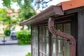 An old gutter in a detached house. Rainwater drainage from the roof Royalty Free Stock Photo