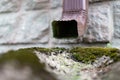 An old gutter in a detached house. Rainwater drainage from the roof Royalty Free Stock Photo