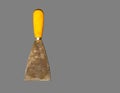 old gyan putty or spatula isolated on gray background, hand tool for construction, look old and dirty. Royalty Free Stock Photo