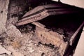 Old half opened rusty chest under wall built out of bricks