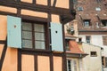 Old half timber fachwerk windows on house in Colmar, France