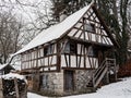 Old half-timbered house^, historic peasant home, winter season landscape Royalty Free Stock Photo