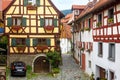 Old half-timbered houses in South Germany. Beautiful typical houses in German village. Vintage narrow street in summer Royalty Free Stock Photo