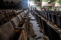 An old hall with seating in an abandoned cinema