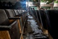 An old hall with seating in an abandoned cinema