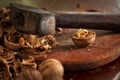 Old hammer with dark aged metal cheek of hammer and scratched polished wood handle closeup. Vintage hammer used as nutcracker with Royalty Free Stock Photo