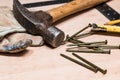 An old hammer, tape measure pencil, nails and gloves Royalty Free Stock Photo