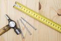 Old hammer , tape measure and nails
