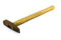 Old hammer with wooden handle on a white background