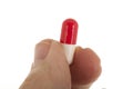 Old hand with capsule pill Royalty Free Stock Photo