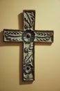 Old hand carved wooden cross with floral design