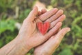 Old hand grandmother hold heart. Concept idea of love family protecting elderly people grandmother friendship togetherness