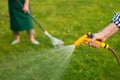 Old hand holding water hose. Royalty Free Stock Photo