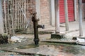 Old hand-operated water pump standing on roadside in the Royalty Free Stock Photo