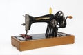 An old, hand sewing machine. Isolated, on white background. Royalty Free Stock Photo