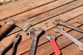 Old hand tool on a wooden surface. Tools for repair and construction Royalty Free Stock Photo