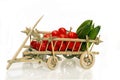 Old handcart full of fruits and vegetables