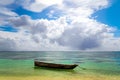 Old handmade african  dhow fishing wooden boat anchored in the ocean in sunny weather Royalty Free Stock Photo