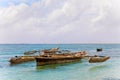 Old handmade african  dhow fishing wooden boat anchored in the ocean in sunny weather Royalty Free Stock Photo