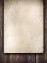 Old handmade paper sheet on wooden background Royalty Free Stock Photo