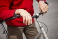 Old hands on the handlebars of an ancient bicycle Royalty Free Stock Photo