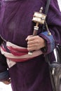 Old hands of a Tibetan man holding prayer buddhist wheel at a Hemis monastery, Leh district, Ladakh, Jammu and Kashmir, north Indi