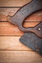 Old handsaw over a wooden boards Royalty Free Stock Photo