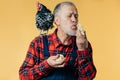 Old handsome farmhand is kissing little chickens on the farm Royalty Free Stock Photo