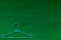 Old hangers clothing on a green background 1