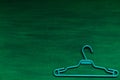 Old hangers clothing on a green background 1