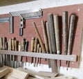 Old hanging Chisels at the wall