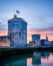 The old harbor of La Rochelle at sunset with its famous old towe