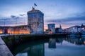 The old harbor of La Rochelle at sunset with its famous old towers