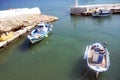 The old harbor on the quiet Greek island of Kasos. Traditional fishing boats moored in sheltered waters.  A peaceful, untroubled Royalty Free Stock Photo