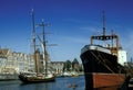 Old cargo steamer and a wooden sailship in Old Town in Gdansk, Poland