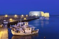 Old harbour of Heraklion with Venetian Koules Fortress, boats and marina at night, Crete.