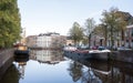 Old harbour with houseboats in the old city of groningen in holland
