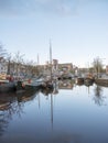 Old harbour with houseboats in the old city of groningen in holland