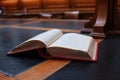 old hard cover book sitting at an old traditional timber reading desk under a glass lamp in an old state library in Melbourne, Royalty Free Stock Photo