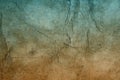 Old hard cracked paper background in dark colors. Royalty Free Stock Photo