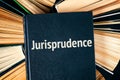 Old hardback books with book Jurisprudence on top